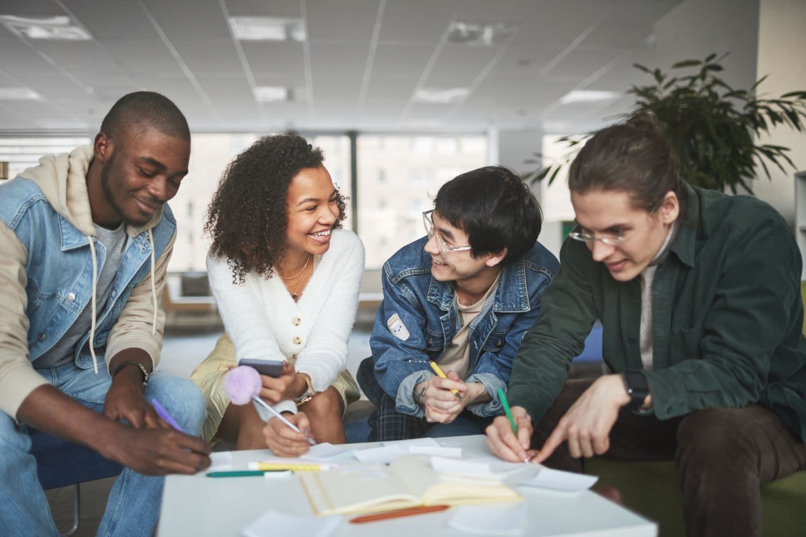 Diverse students collaborating around a table