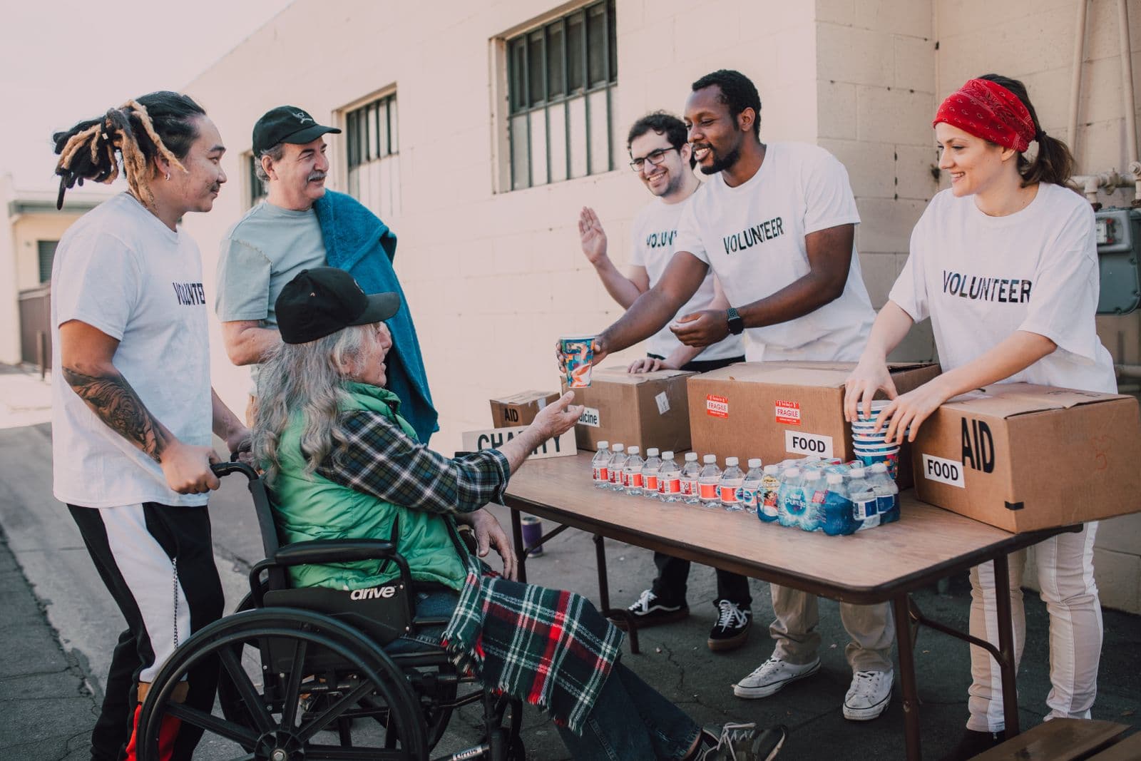 Volunteers distributing aid to the community
