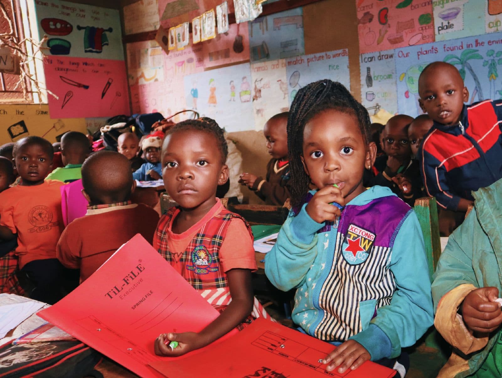 Children learning in a bright classroom